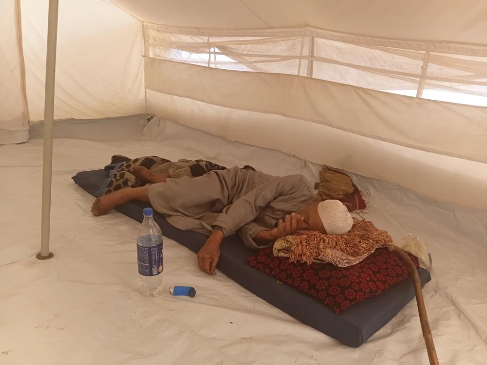Jumaa Abu Khatla, Rahaf’s father, resting on a thin mattress inside a tent in Gaza.