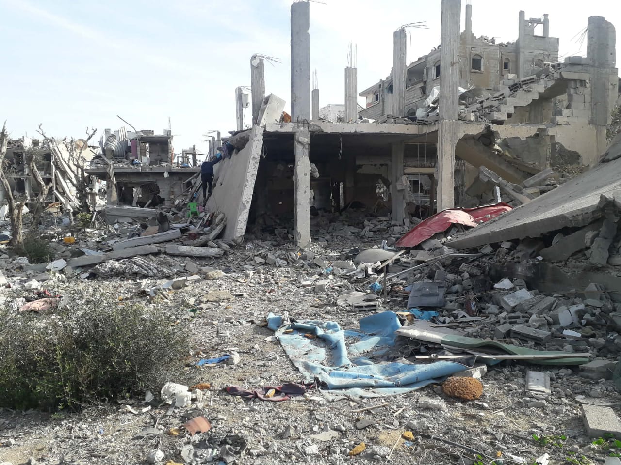 The remains of Rahaf’s family home in Gaza, reduced to a skeletal concrete building and rubble.
